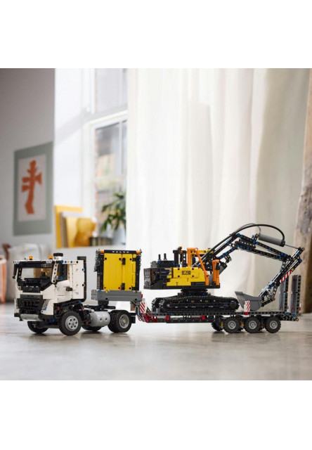 Nákladné auto Volvo FMX a elektrický bager EC230